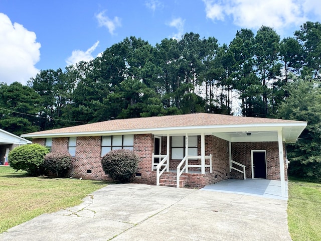 ranch-style home with a front lawn and a carport