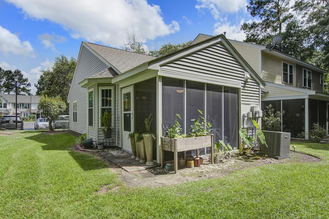 8059 Shadow Oak Dr, North Charleston, SC 29406 - rear view of house with a sunroom, a yard, and a shingled roof