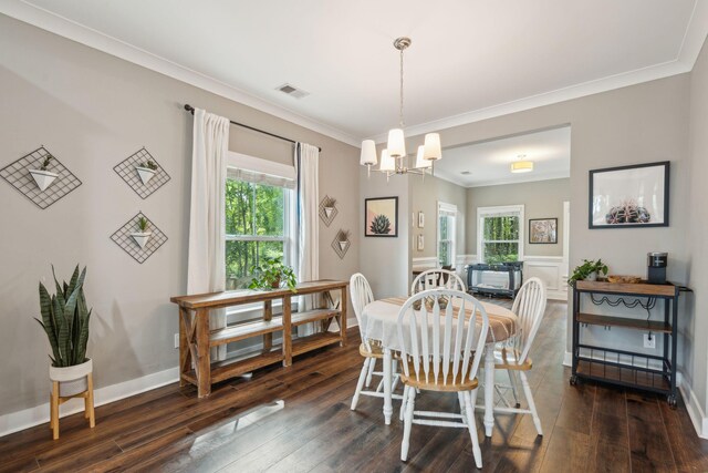 dining space featuring a chandelier, dark hardwood / wood-style floors, and plenty of natural light