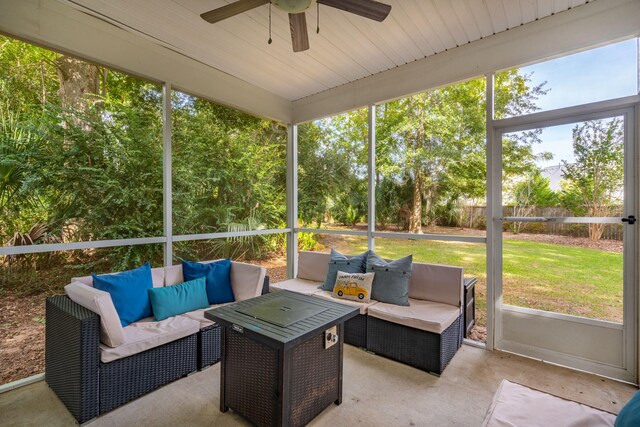 sunroom featuring ceiling fan