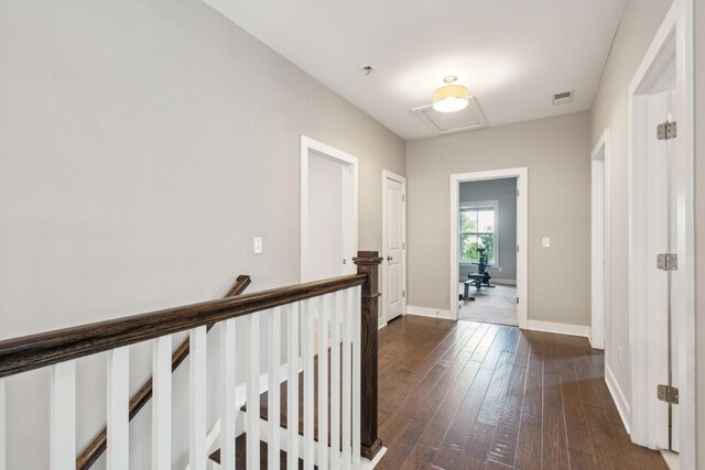 corridor featuring dark hardwood / wood-style flooring