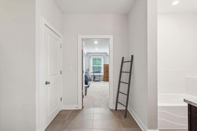 corridor with tile patterned flooring