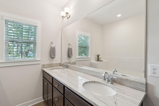 bathroom featuring vanity and a wealth of natural light