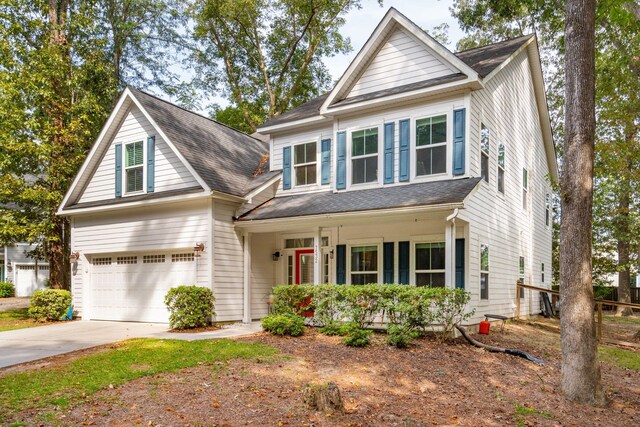 view of front of property with a porch and a garage