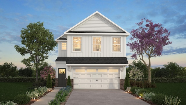 traditional home featuring driveway, a garage, a shingled roof, a lawn, and board and batten siding