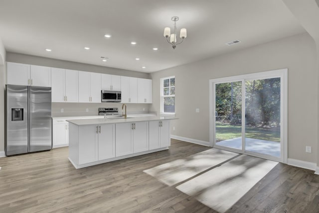 5629 Ellington School Rd, Ravenel, SC 29470 - kitchen featuring appliances with stainless steel finishes, baseboards, light countertops, white cabinets, and recessed lighting