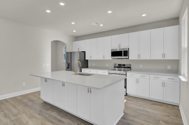 5629 Ellington School Rd, Ravenel, SC 29470 - kitchen with stainless steel appliances, a sink, a center island with sink, light countertops, and recessed lighting