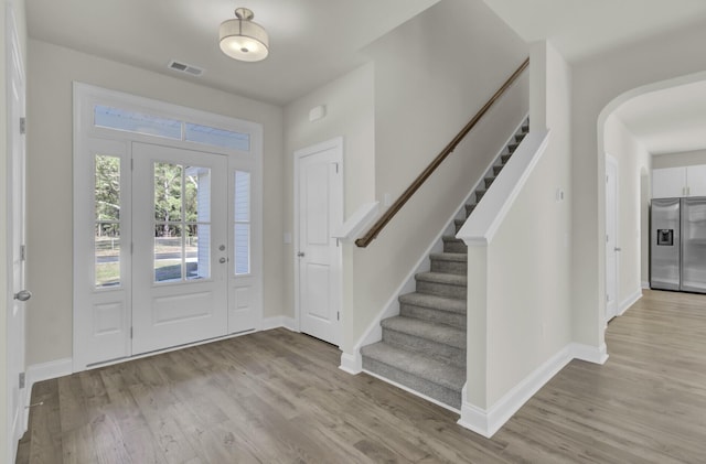 5629 Ellington School Rd, Ravenel, SC 29470 - foyer entrance featuring wood finished floors, baseboards, and stairway