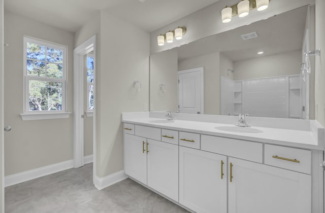 5629 Ellington School Rd, Ravenel, SC 29470 - bathroom with double vanity and baseboards