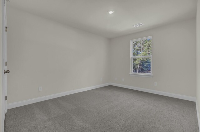 5629 Ellington School Rd, Ravenel, SC 29470 - empty room featuring dark colored carpet, baseboards, and recessed lighting