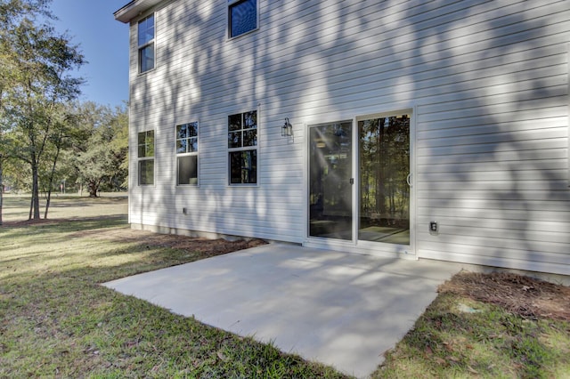 5629 Ellington School Rd, Ravenel, SC 29470 - rear view of property with a patio area and a lawn
