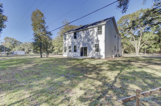 5629 Ellington School Rd, Ravenel, SC 29470 - back of property with a lawn and central AC unit