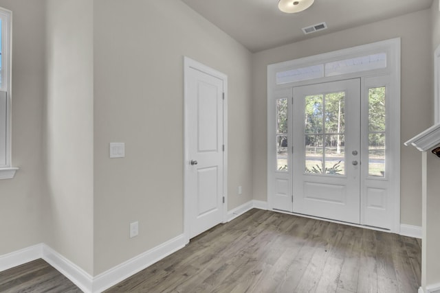 5629 Ellington School Rd, Ravenel, SC 29470 - foyer entrance with wood finished floors and baseboards