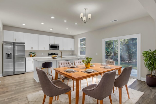 5629 Ellington School Rd, Ravenel, SC 29470 - dining space featuring light wood-style flooring, recessed lighting, a chandelier, and baseboards
