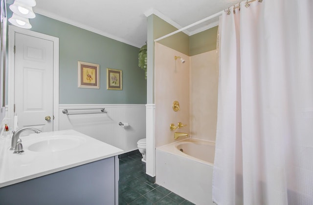full bath featuring a wainscoted wall, toilet, tile patterned floors, vanity, and shower / tub combo with curtain