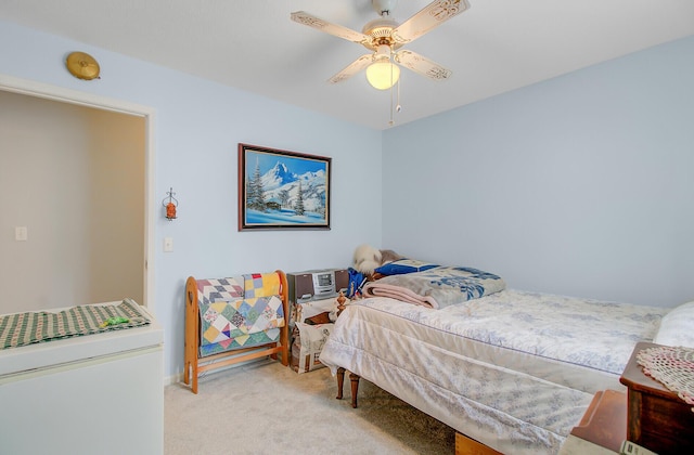 bedroom with a ceiling fan and carpet floors