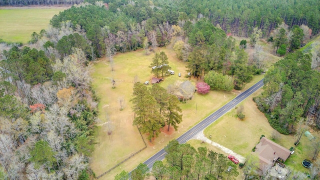 aerial view with a wooded view and a rural view