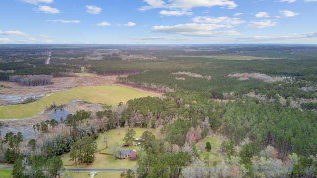 bird's eye view featuring a wooded view