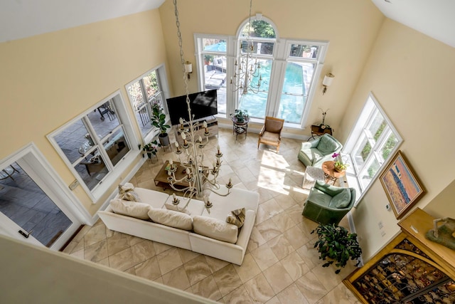 living area with high vaulted ceiling