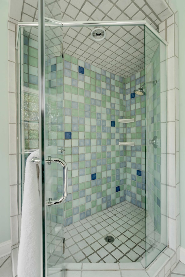 bathroom featuring a shower stall