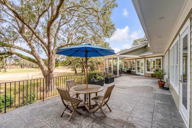 view of patio / terrace featuring french doors and outdoor dining space