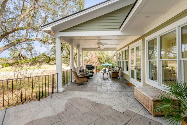 view of patio featuring ceiling fan