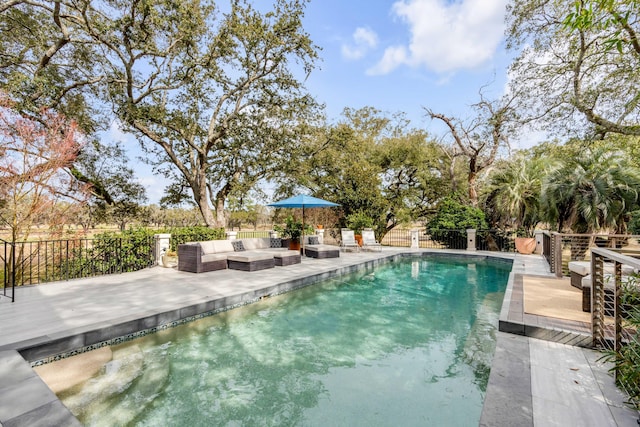 view of swimming pool featuring fence, an outdoor living space, and a fenced in pool