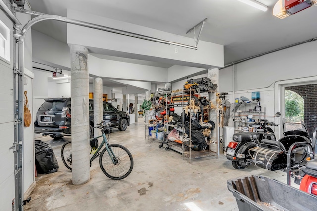 garage featuring a garage door opener and bike storage