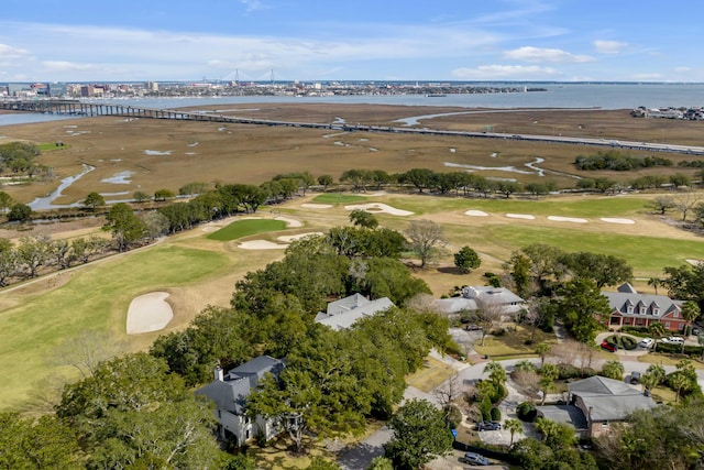 birds eye view of property featuring view of golf course and a water view