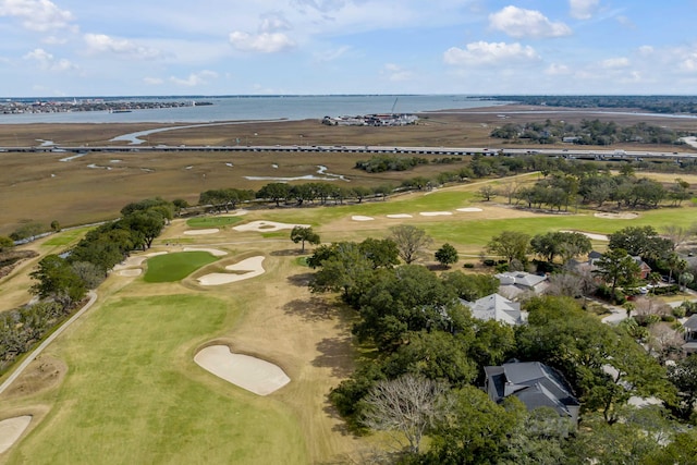 birds eye view of property featuring golf course view and a water view