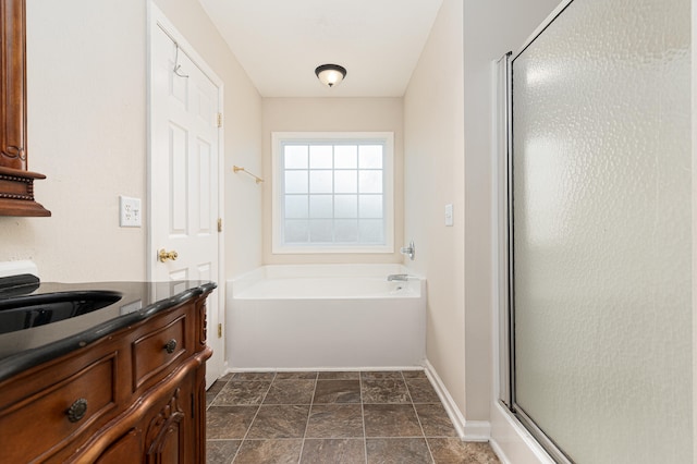 bathroom with separate shower and tub, tile floors, and vanity