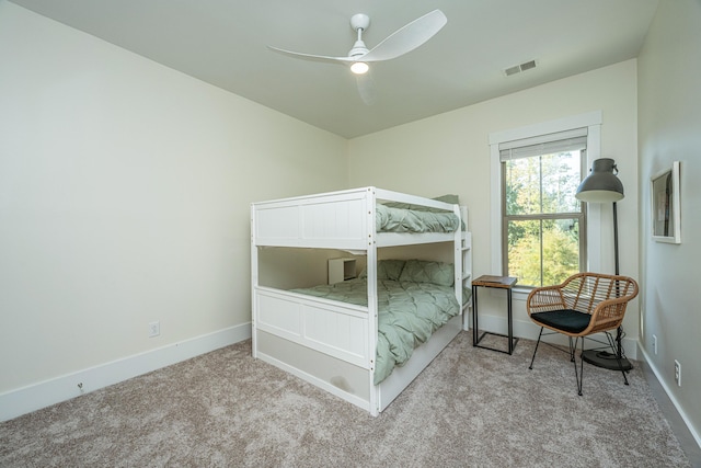 bedroom with ceiling fan and light carpet