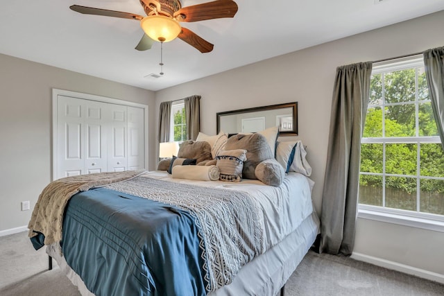 bedroom featuring baseboards, a closet, and carpet floors