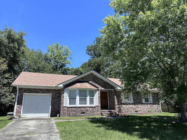 view of front of property with a garage and a front lawn