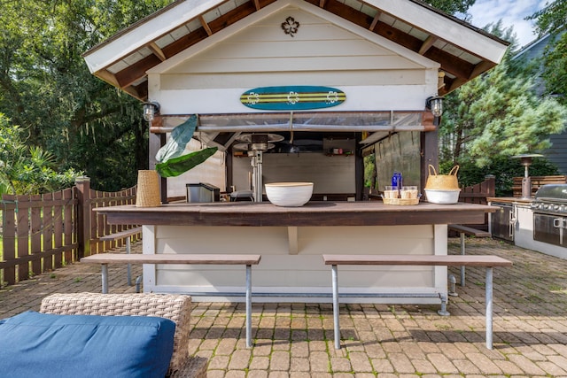 view of patio / terrace featuring a gazebo and an outdoor bar