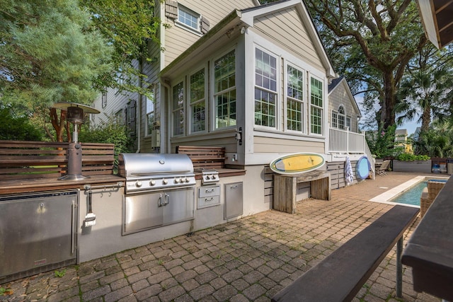 view of patio / terrace featuring an outdoor kitchen and area for grilling