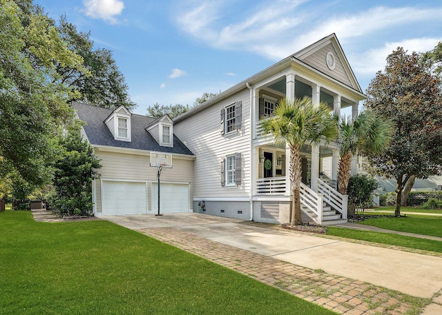 view of front of house with a garage and a front lawn