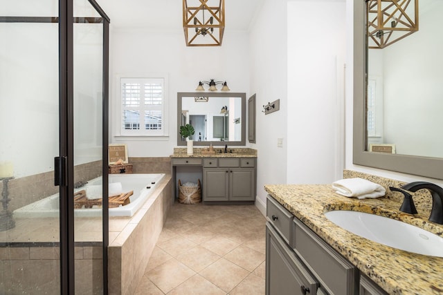 bathroom featuring vanity, tile patterned floors, ornamental molding, and separate shower and tub