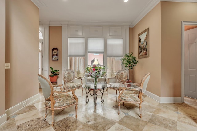 living area featuring crown molding