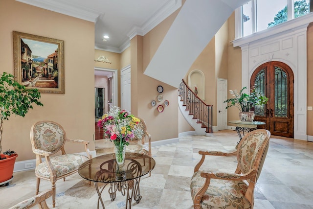 foyer entrance featuring ornamental molding