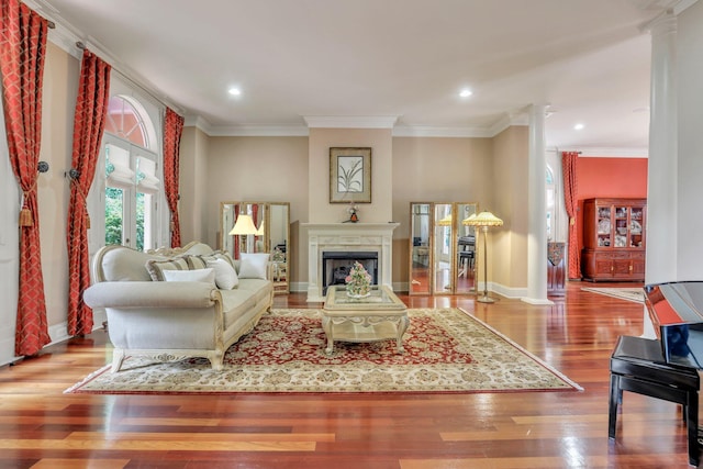 living room with light wood-type flooring and crown molding