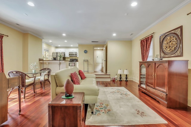 living room featuring crown molding and hardwood / wood-style floors