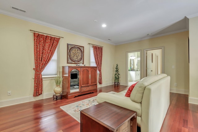 living room featuring ornamental molding and hardwood / wood-style flooring