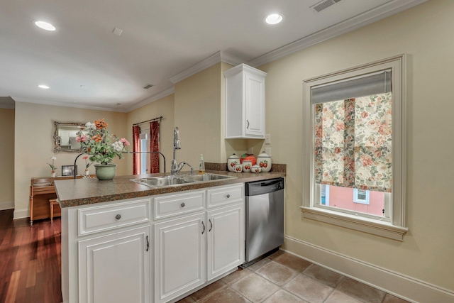 kitchen featuring ornamental molding, white cabinetry, dishwasher, kitchen peninsula, and light hardwood / wood-style floors