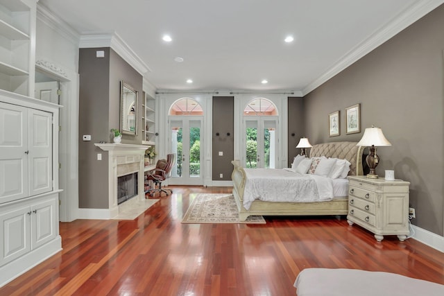 bedroom featuring crown molding, wood-type flooring, french doors, and access to outside