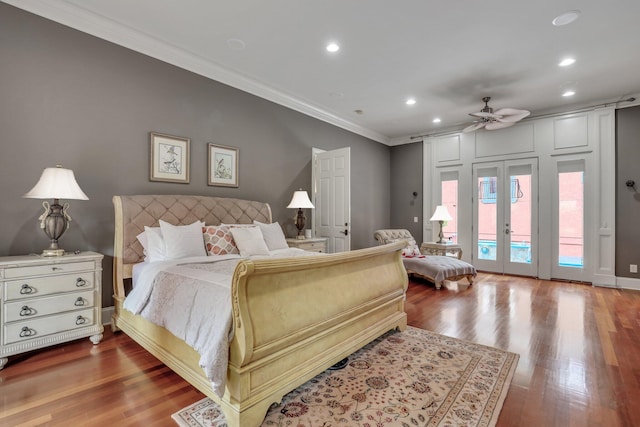 bedroom featuring ornamental molding, dark wood-type flooring, access to exterior, and ceiling fan