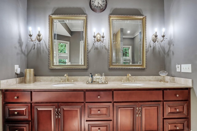 bathroom featuring ornamental molding and vanity