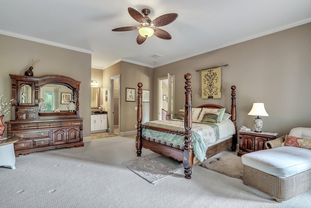 carpeted bedroom featuring ornamental molding, ensuite bathroom, and ceiling fan