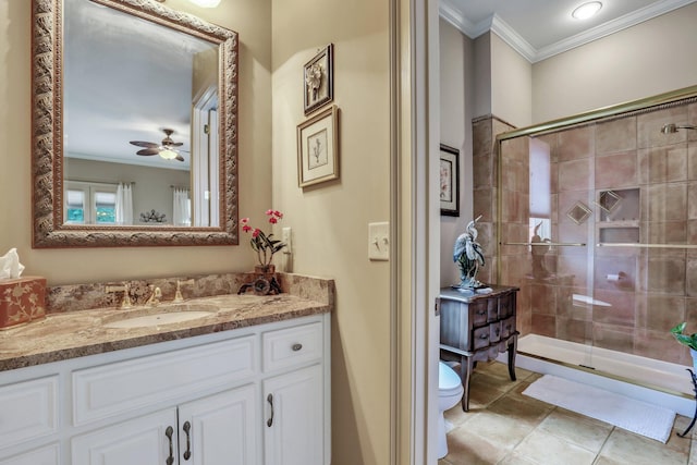 bathroom with vanity, a shower with shower door, crown molding, toilet, and ceiling fan