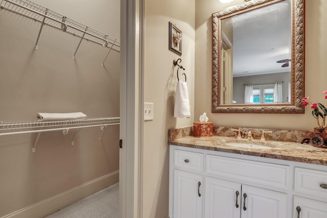 bathroom with vanity and ceiling fan